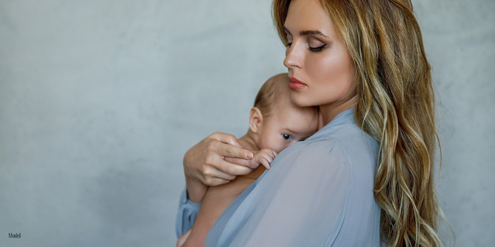 Mother holding her baby